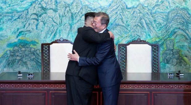 South Korean President Moon Jae-in and North Korean leader Kim Jong Un embrace at the truce village of Panmunjom inside the demilitarized zone separating the two Koreas.