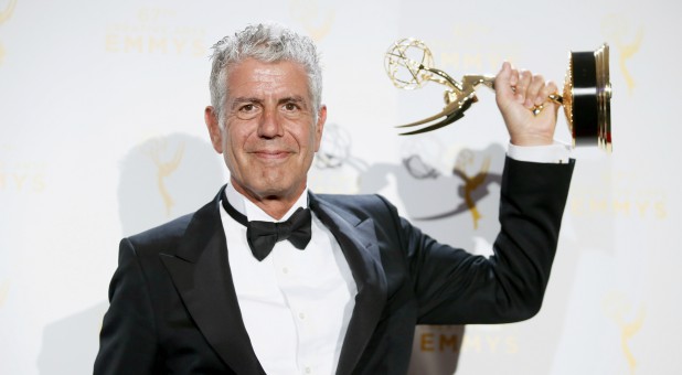 Anthony Bourdain poses with the outstanding informational series or special award for