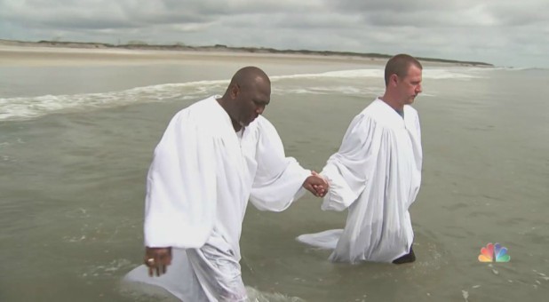 Ken Parker, right, prepares for baptism.