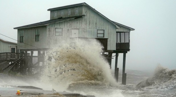 Waves take over a house as Hurricane Michael comes ashore in Alligator Point, Florida.