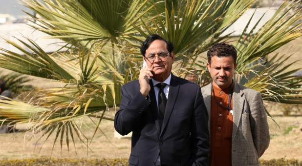 Saiful Mulook (L), lawyer for Asia Bibi, a Pakistani Christian acquitted of capital blasphemy charges, talks on a mobile phone at the premises of the Supreme Court in Islamabad, Pakistan, Jan. 29, 2019.