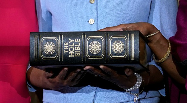 Rep. Sheila Jackson Lee (D, Texas) poses with a Bible.