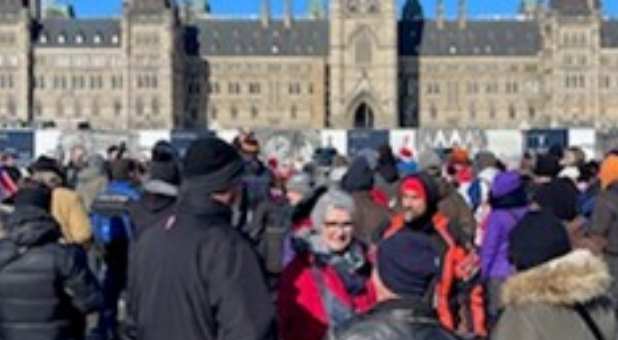 Truckers singing hymns in front of the Canadian Parliament Building,