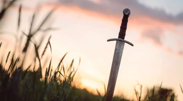 Sun setting on a warrior's sword.