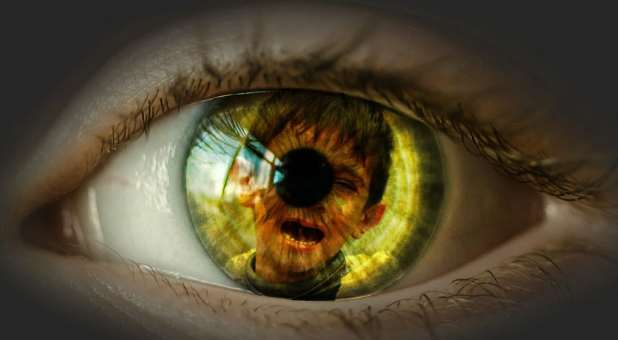 eye with crying child superimposed on pupil