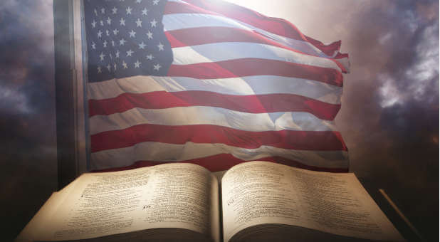 American flag behind Bible