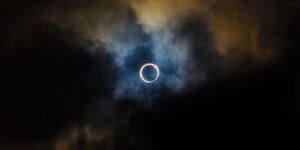 solar eclipse amid clouds